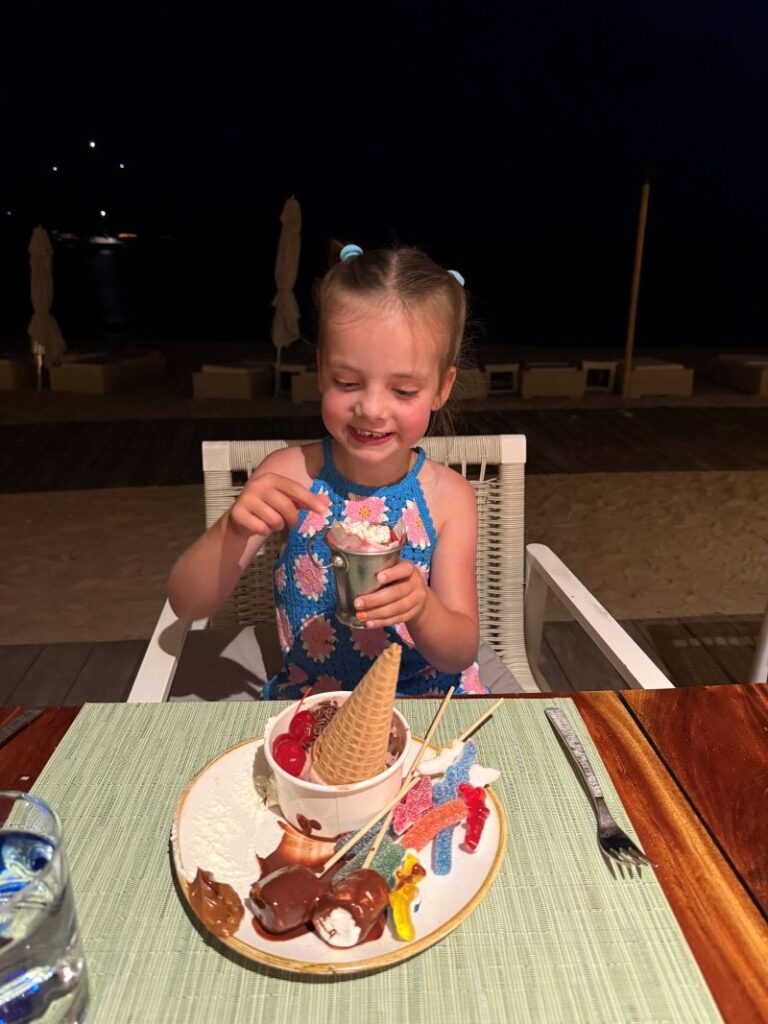 Six-year-old girl with a dessert plate at the Bonté buffet, Sugar Beach Resort.